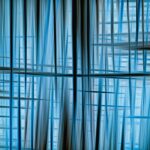 Dynamic abstract image featuring intersecting blue lines and patterns with a serene and modern feel.