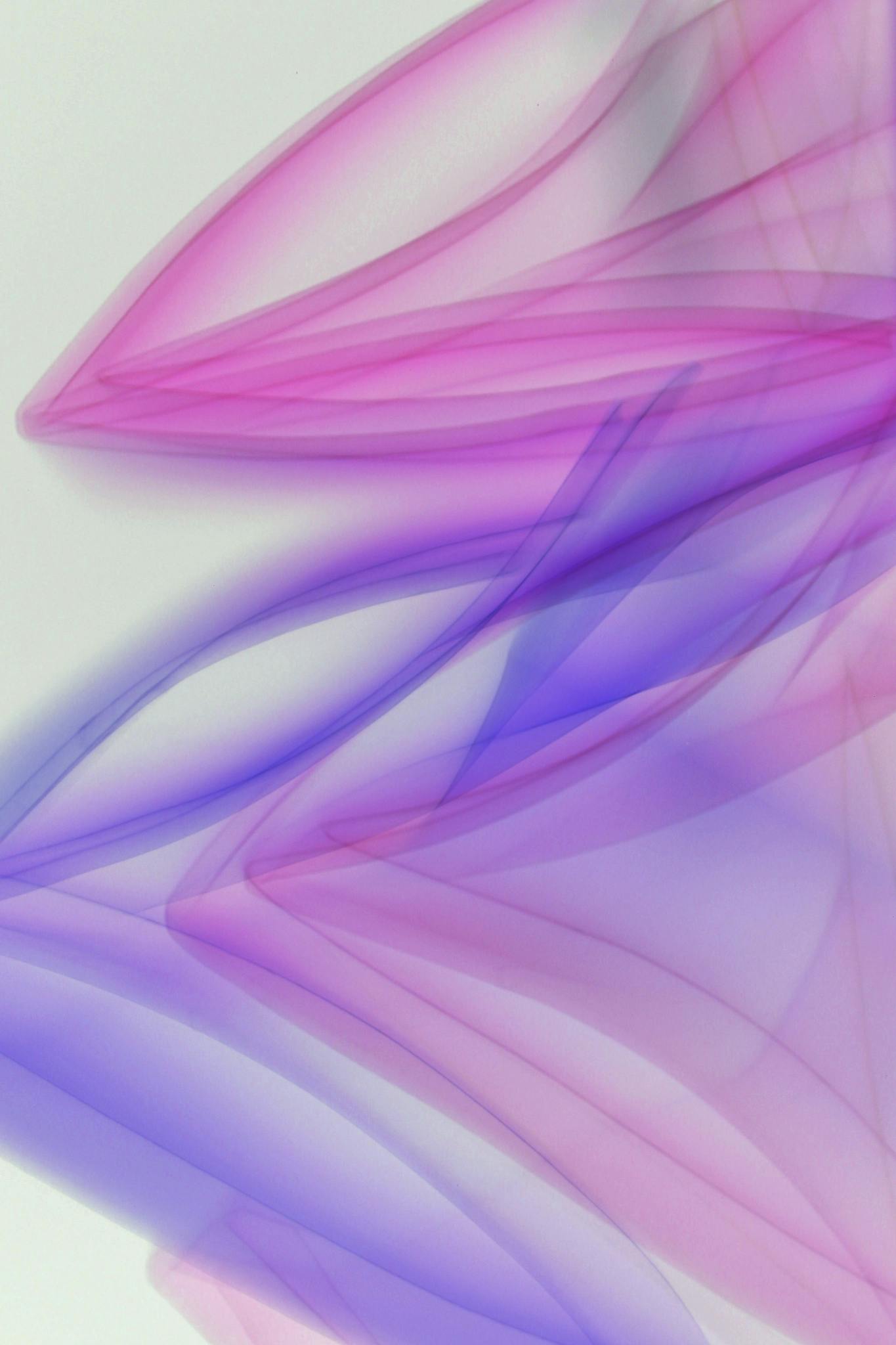 Vibrant abstract artwork with purple and pink flowing patterns, creating a dynamic visual effect.